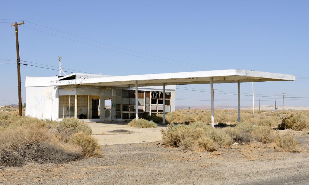 An old gas station sits along a stretch of highway that was replaced by a freeway 