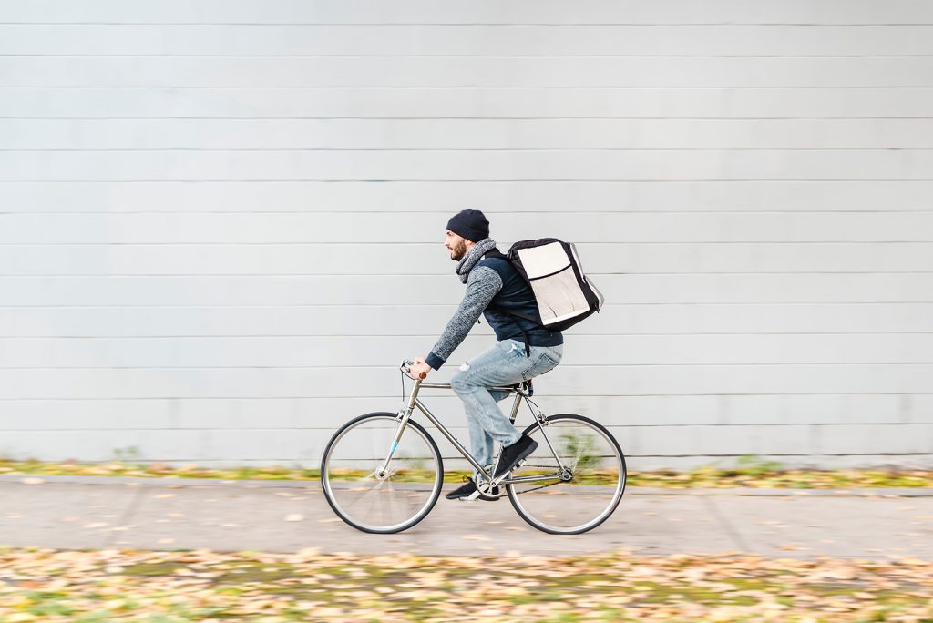 Food delivery courier riding fast