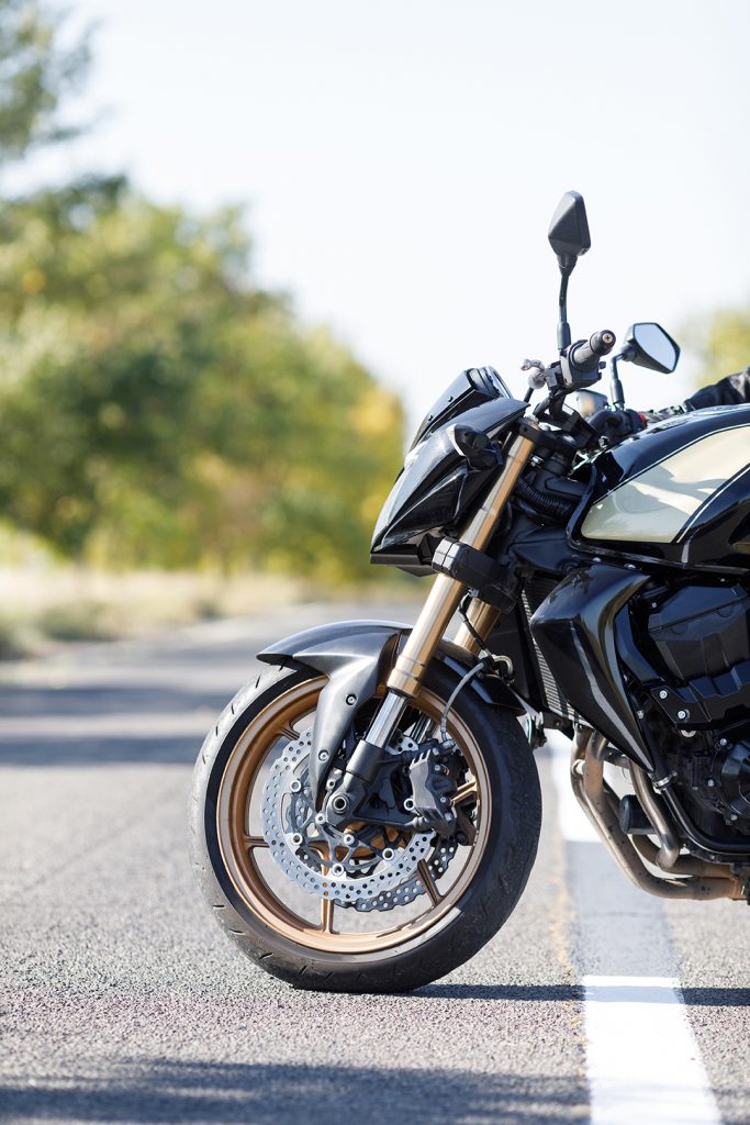 A motorcycle close-up stands on the road alone