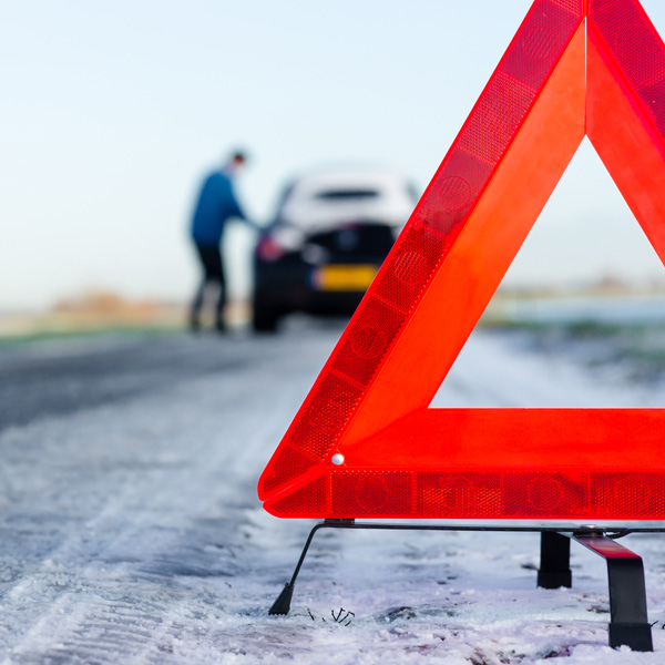 A car with a breakdown alongside the road